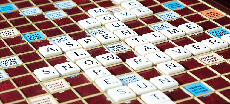 A game of scrabble sits ready for players to resume spelling Aspen-relevant words.